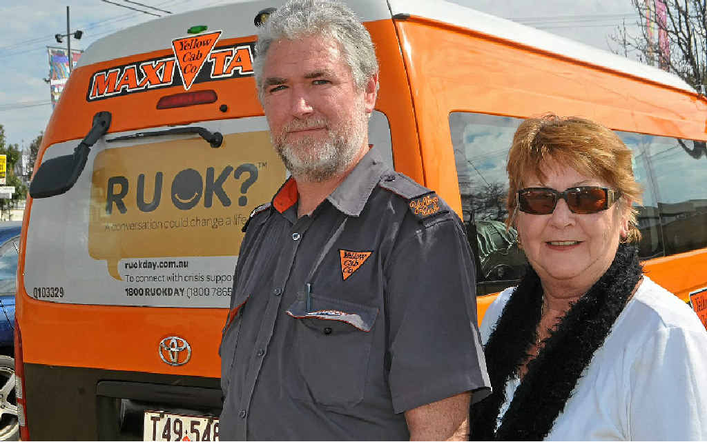 Owner of Warwick Yellow Cabs Nancy Miller, pictured with driver Gary Lang, put R U OK? stickers on two of her cabs which service Warwick.